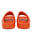 POV of orange Chupster with textured footbed