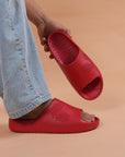 Styled shot of Chupster held in hand and on foot