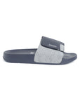 A navy and grey slide-on slip-resistant sole men's slimmer with a adjustable velcro strap and cushioned footbed.