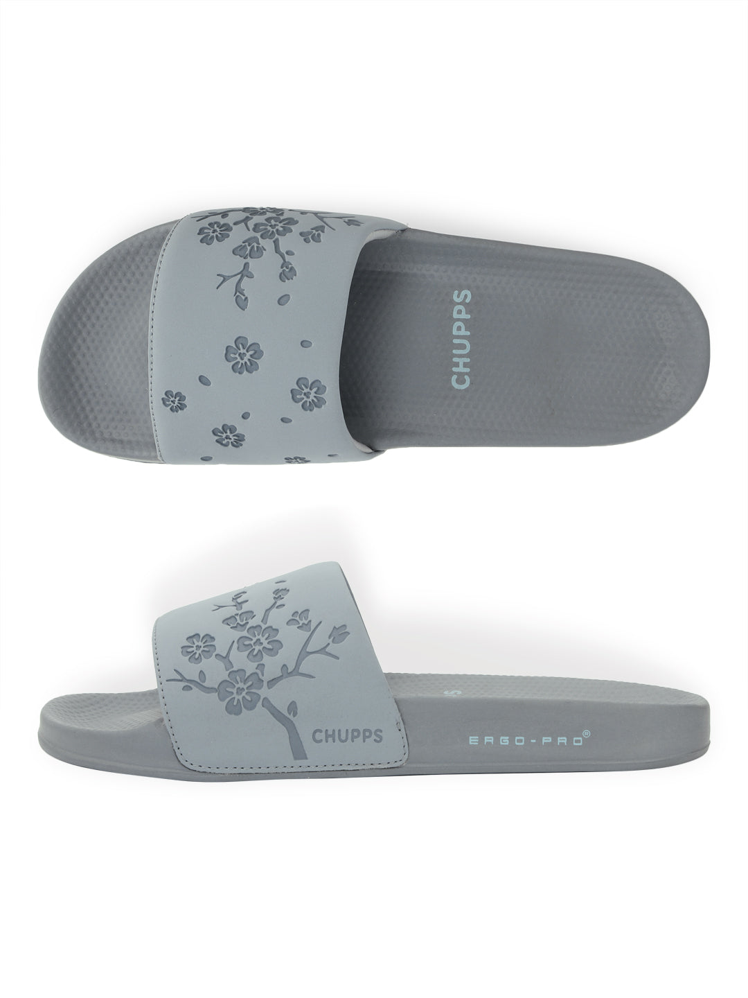 Close-up of traction outsole on grey sliders for steady steps.