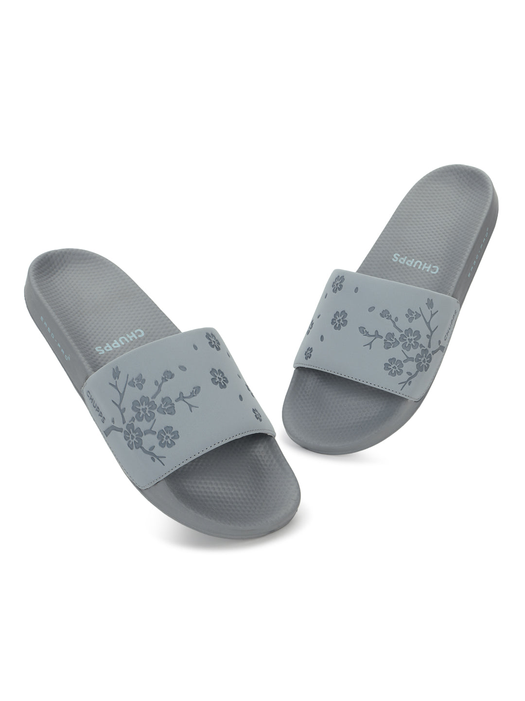 Dynamic top profile of grey sliders highlighting slim strap and minimal shape.