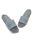Dynamic top profile of grey sliders highlighting slim strap and minimal shape.