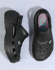 Black sandel with a visible brand logo inside 