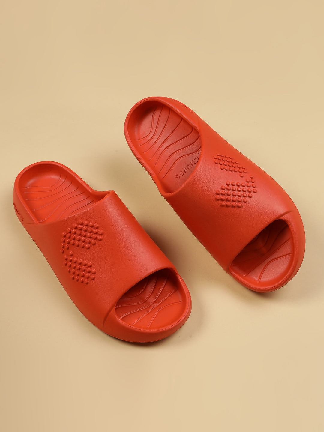 Dynamic view of Orange Chupster on a light brown background