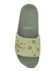Close-up of traction outsole on Pista Green sliders for steady steps.