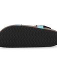 Black sandal sole with wavy pattern on a white background