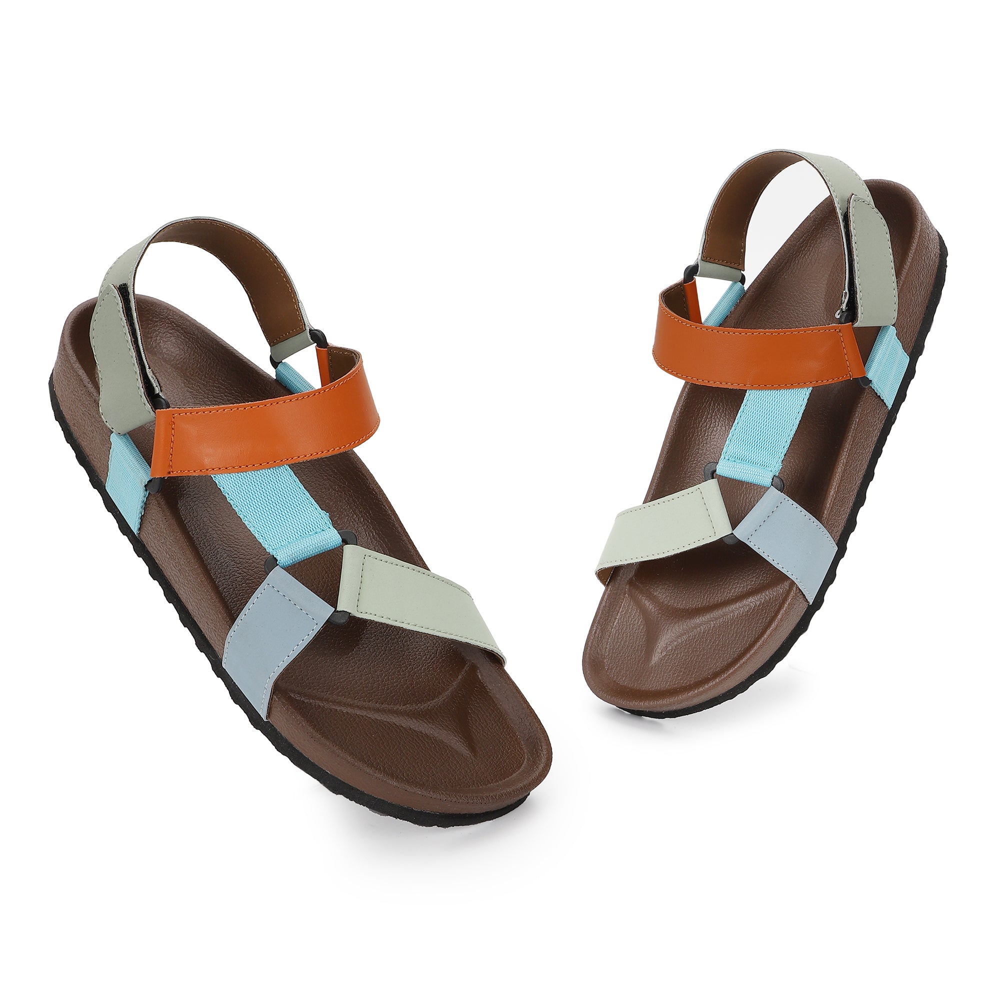 Pair of sandals with brown, orange, and multicolor straps on a white background