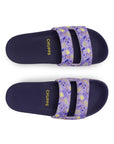 Pair of navy slides with purple floral straps on a white background