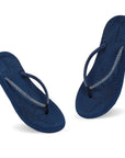 Navy blue flip-flops placed on a white background.