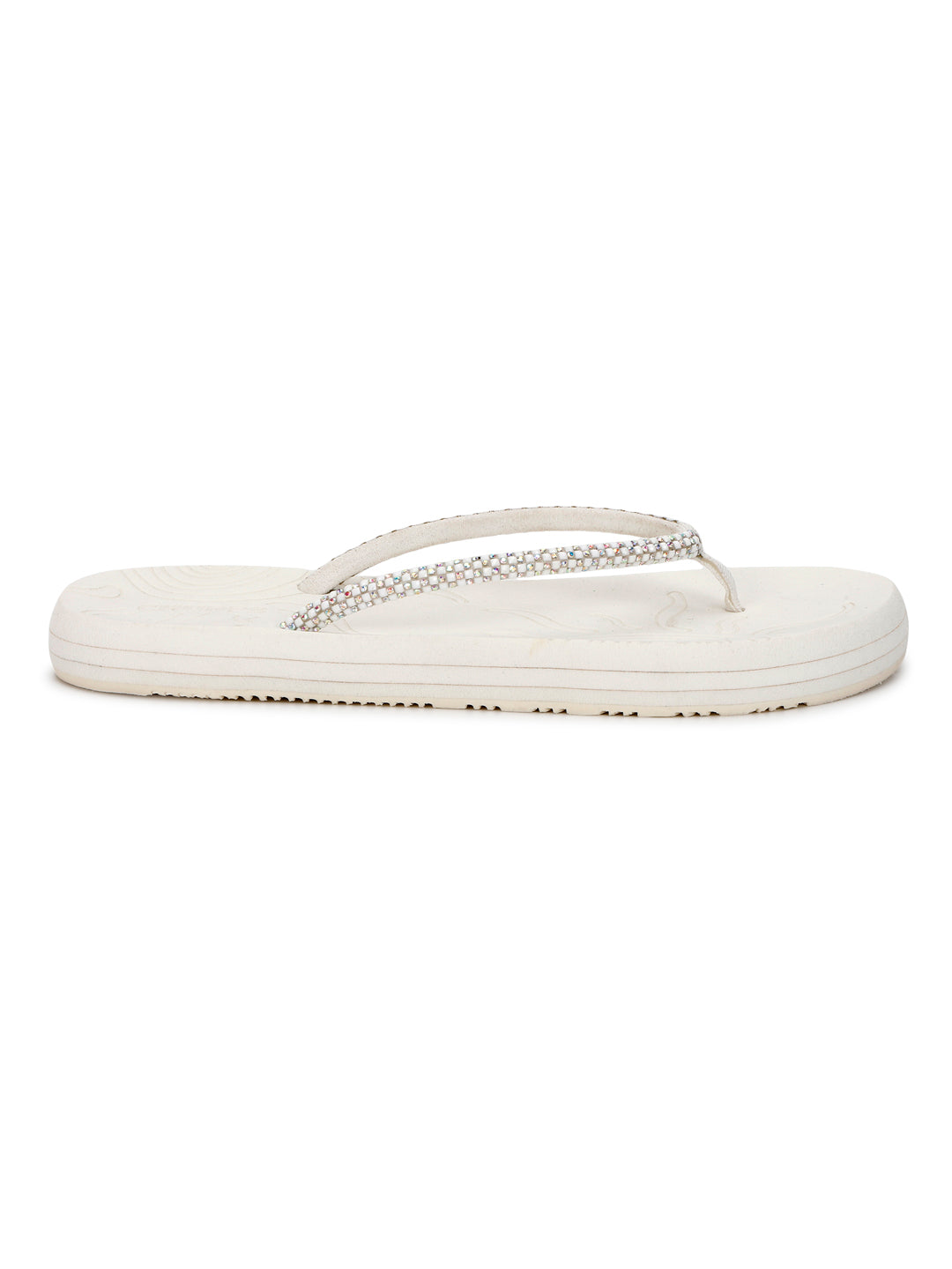 Solis White slider side profile showing cushioned beige base and straps with diamond-like shine