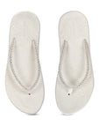 Overhead and underside view highlighting textured sole and comfy footbed of Solis White