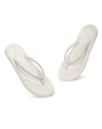 Close-up of white V-strap with fine embellishments for a touch of effortless glam