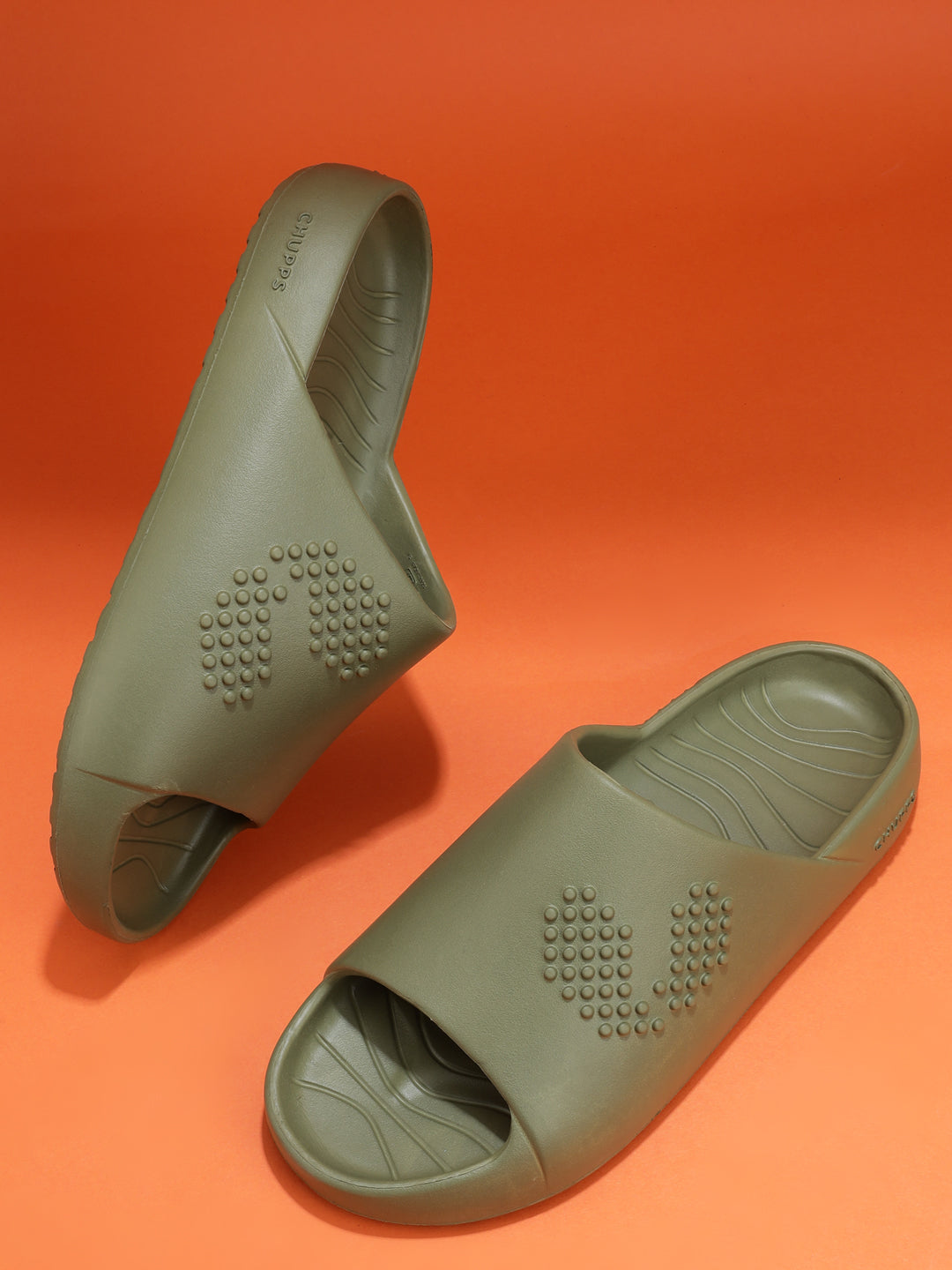 Pair of olive green Chupster on an orange background, top and side view