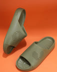 Pair of olive green Chupster on an orange background, top and side view