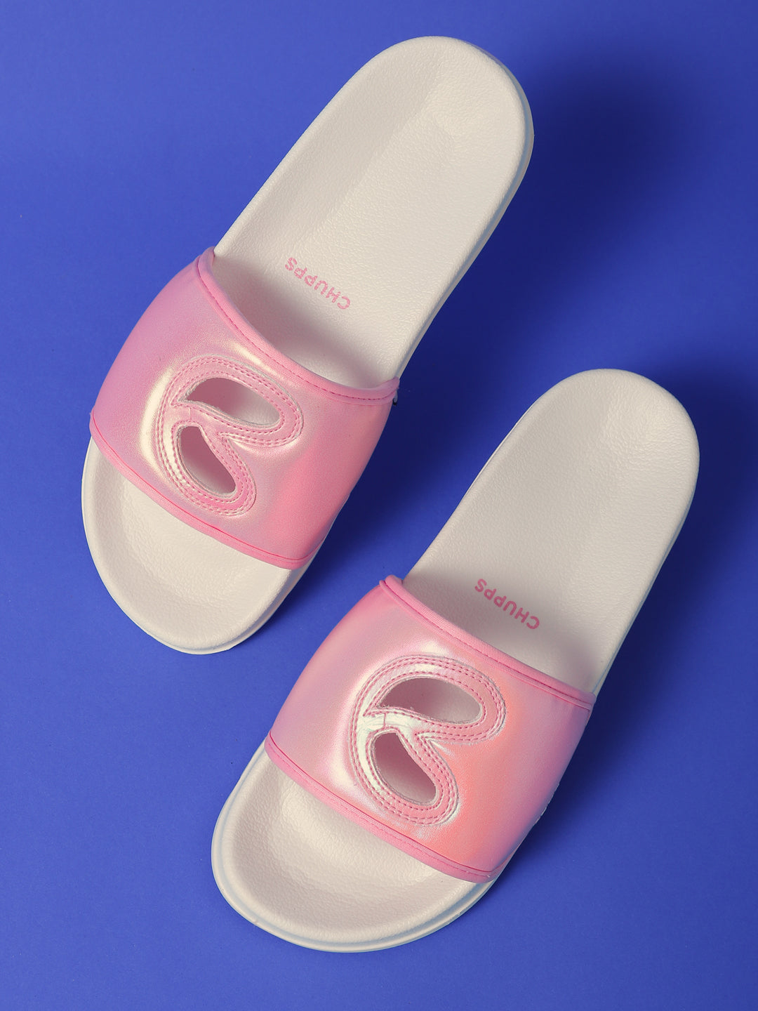 Casual glam sliders for women with slit upper and ErgoX sole on a blur background
