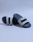 Chupps Zella Sky Blue Denim Sliders with sky blue denim strap and central cut-out. On a light blue background