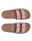 Pair of brown Mimo sandals with floral straps on a white background