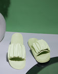 Chupps Ruffel light green ruffle slider with gathered upper and pastel tone.
