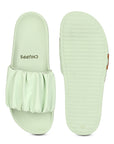 Close-up of gathered ruffle texture on light green strap and Ergo pro sole