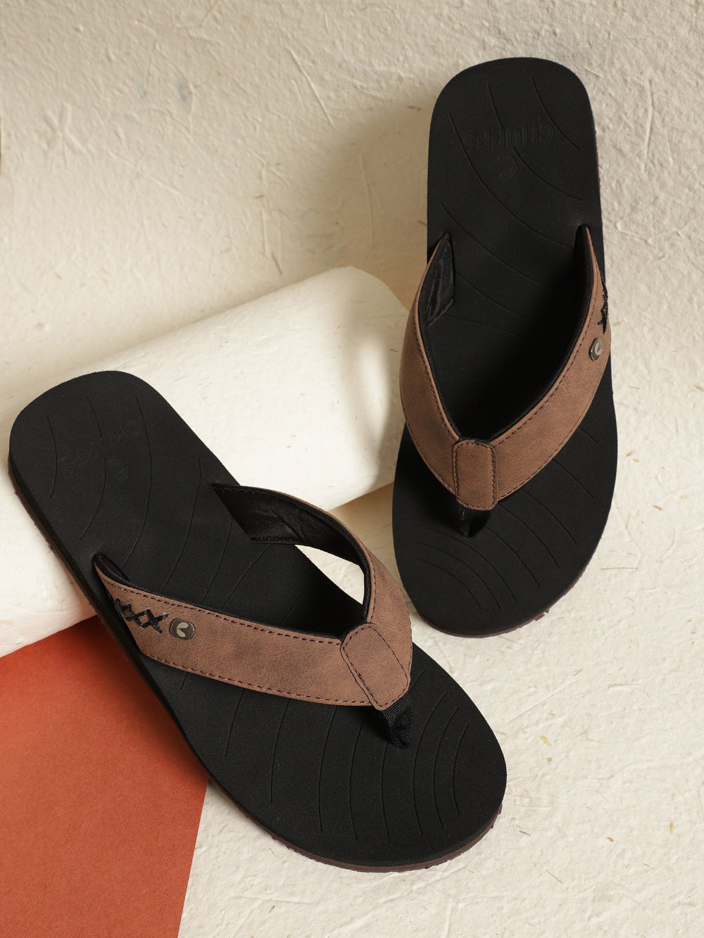 X-Flex brown & black V-strap top view showing URO Foam footbed.