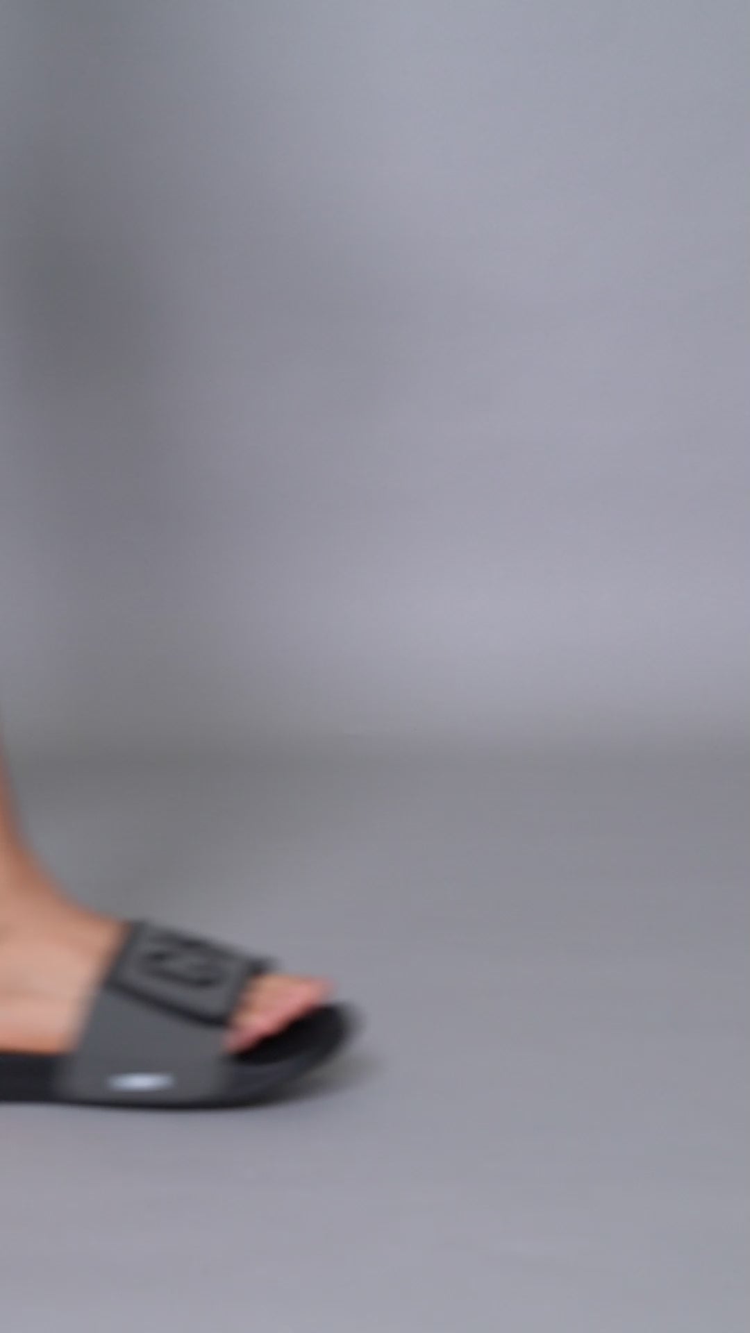 Chill Out black grey sliders — adjustable Velcro, FOAM6 padding, styled with denim and t-shirt.
